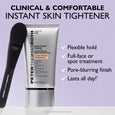 White tube of Instant FIRMx face tightener with silver cap and black application brush on lavender background.