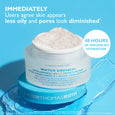 Clear glass jar with white hyaluronic jelly moisturizer on blue background with product label and applicator.