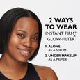 Woman with dark skin displaying dewy, luminous complexion on her face and shoulder.