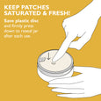 Hand pressing plastic disc onto gold hydra-gel eye patch jar with instruction text on yellow background.