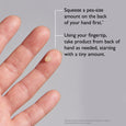 Pale beige eye cream product shown as pea-sized droplet on fingertip with application instructions.