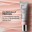 Silver tube with pink base and metallic cap labeled "Instant Firm Lip Filler" containing 10 ml product.