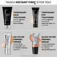 Clear tube of Instant FIRMx No-Filter Firming Primer with silver cap and nude-toned product swatch displayed on gray backgrou