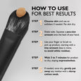 Black brush with tan-colored eye tightening formula applied to bristles, accompanied by usage instructions.