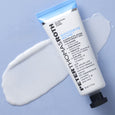 White tube with blue cap of Goodbye Acne Complete Acne Treatment Gel displayed with swatch on light blue background.