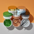 Five Peter Thomas Roth gel patch containers in green, gold, tan, and silver with visible gel textures and curved eye patches 