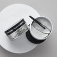 Peter Thomas Roth collagen hydra-gel face and eye patches in a black and white container with applicator on white surface.