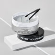 Two jars of collagen hydra-gel face and eye patches with applicator tool, one labeled FIRMx and one Peter Thomas Roth.
