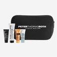 Five Peter Thomas Roth skincare products in black, white, orange, and blue tubes with black zippered pouch.