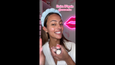 Person holding three circular cosmetic stick products in bronze and neutral tones against pink neon background.